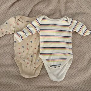 Pact Baby Onesies in Cream and Multicolor
